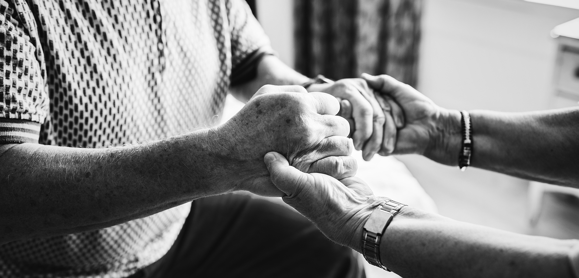 holding elderly person's hands